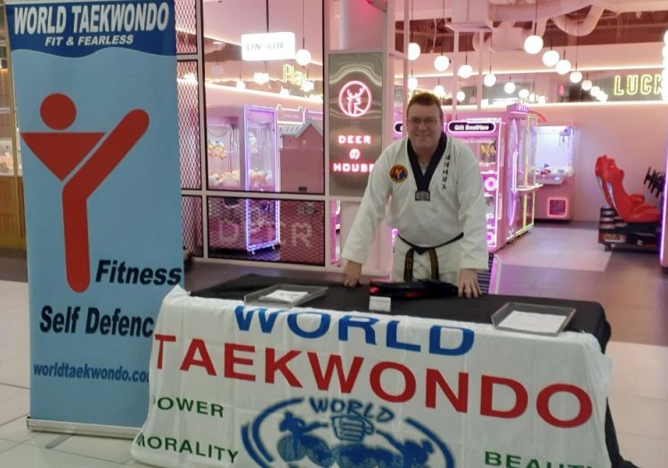 Michael Gregory at a stand promoting World Taekwondo at the shopping centre